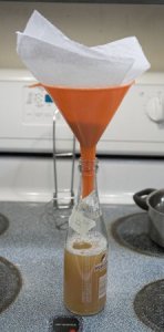 Figure 4 - After the boil was complete, the hot wort was filtered through a paper towel set in a funnel